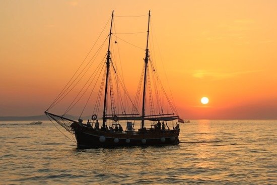 Sailboat at Sunset A sailboat with the sun setting behind